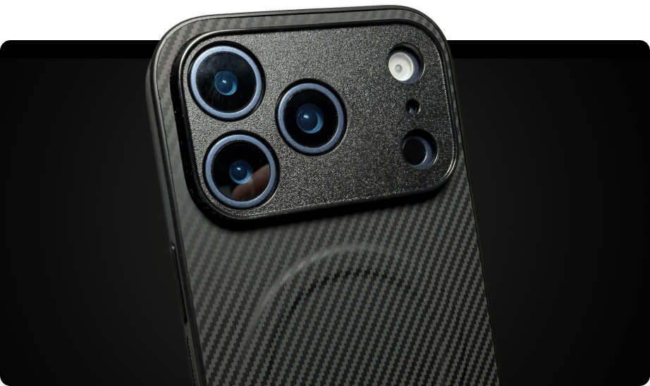 Close-up of the rear camera module on a smartphone with a carbon fibre textured case, showing three camera lenses, a flash, and two small sensor openings against a dark background.